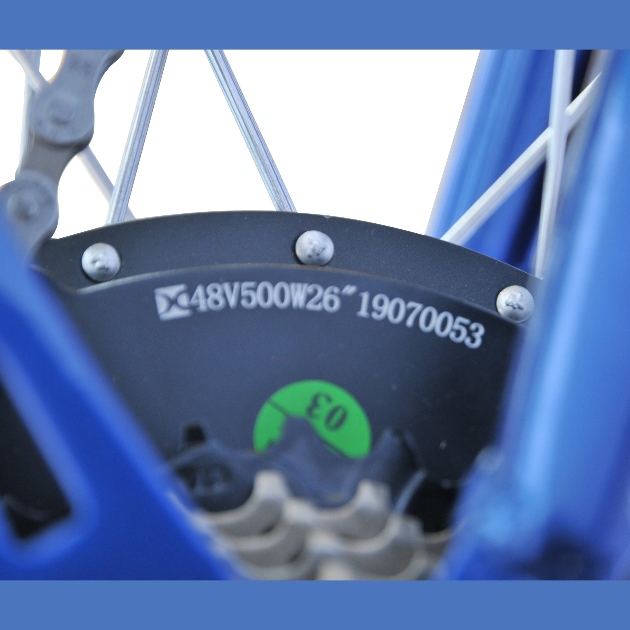 Rear wheel hub detail on blue tandem bike showing 500W motor and fender