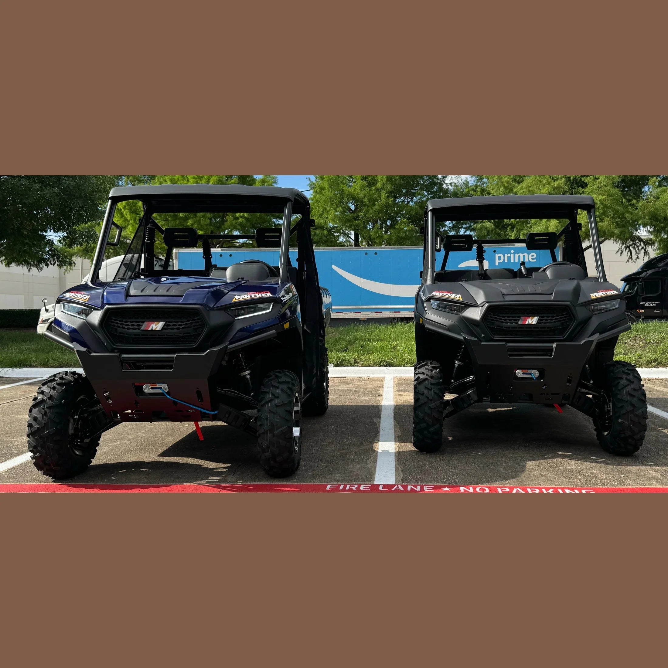 Two Panther UTVs, blue and black, parked side by side in a lot with off-road tires and roll cages.