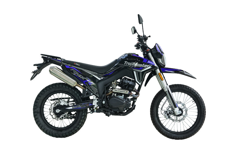 Full side-profile of blue and black TrailMaster RMX250 with high-mounted rack