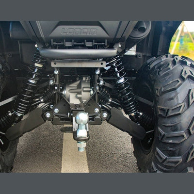 Low-angle close-up of rear suspension coil springs and tow ball mount on Loncin XWolf 550L ATV