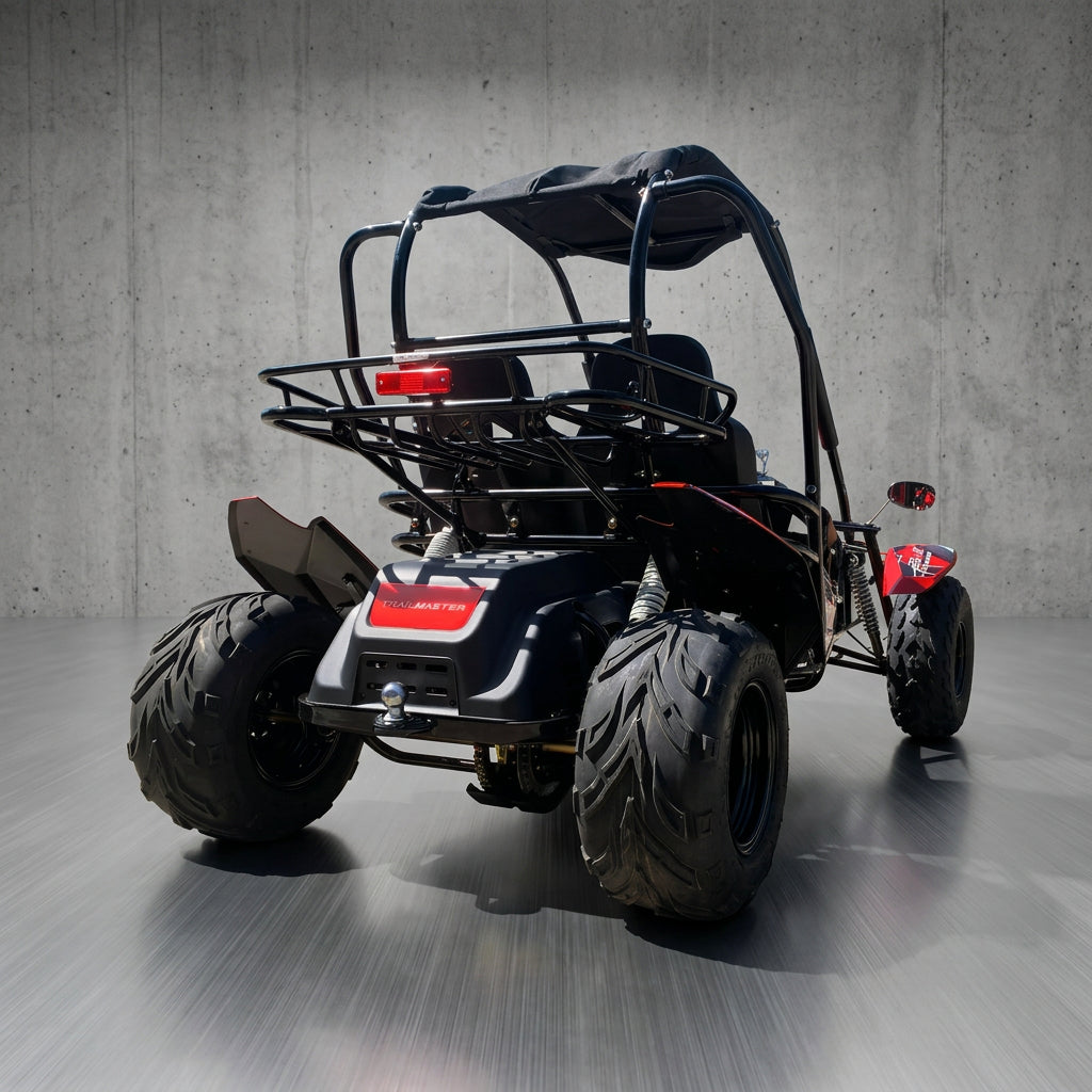 Rear view of black TrailMaster Blazer i2K go kart featuring rear suspension and cargo rack