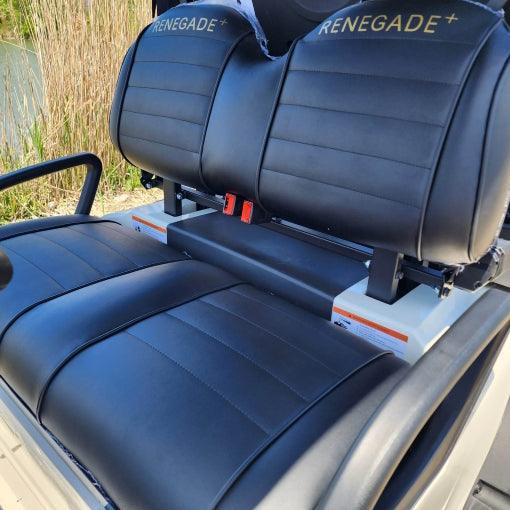 Renegade+ embroidered headrest detail on black upholstered golf cart seats
