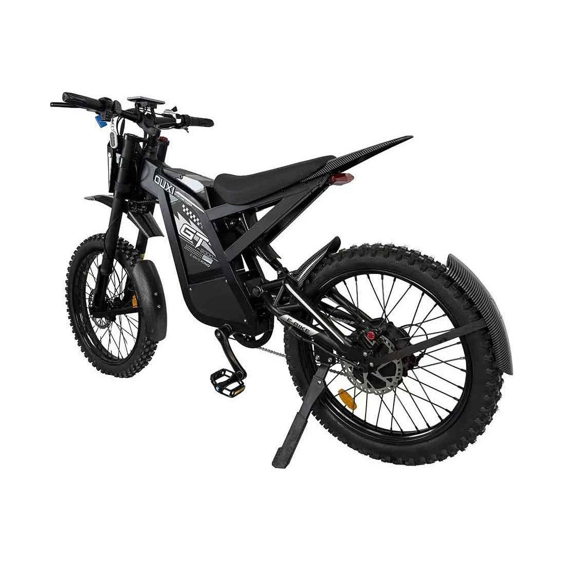 Rear three-quarter view of black electric dirt bike with disc brakes