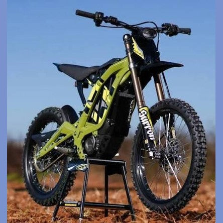 Lime green Skytour electric dirt bike side profile on grass with gold forks