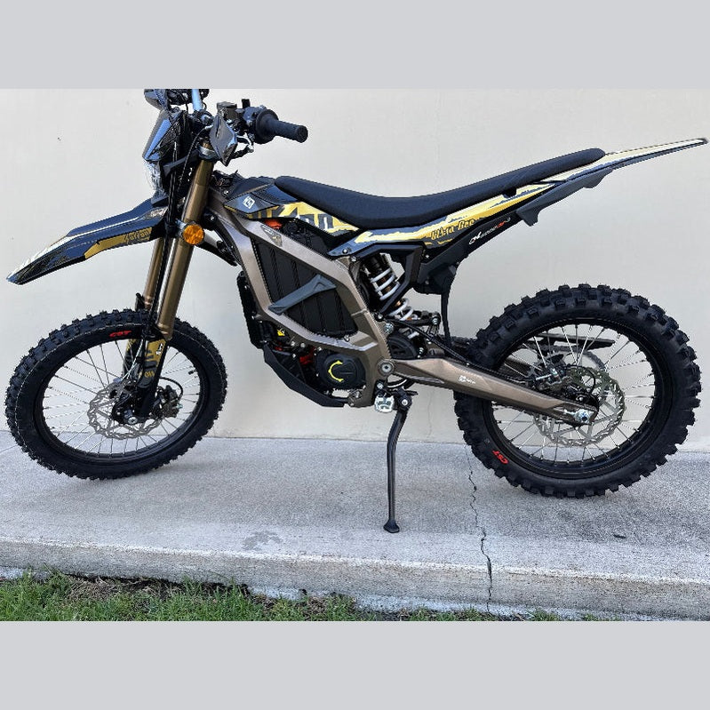 Surron Ultra Bee electric dirt bike full side profile matte taupe with gold forks and CST tires