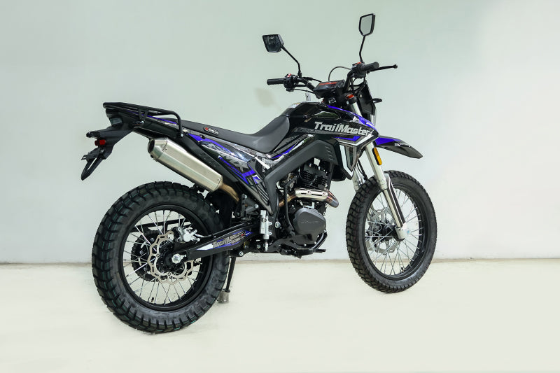 TrailMaster RMX250 blue and black dual sport motorcycle side profile with knobby tires