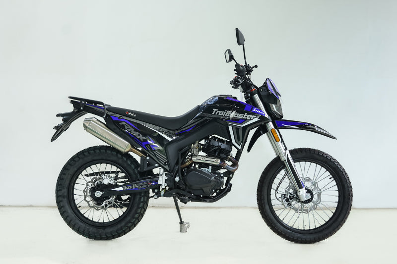 Blue and silver TrailMaster RMX250 dual sport dirt bike with 17-inch rear wheel and LED headlight