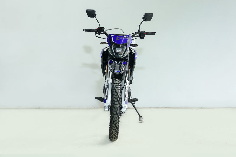 Front view of blue TrailMaster RMX250 dirt bike with inverted forks and LED headlight