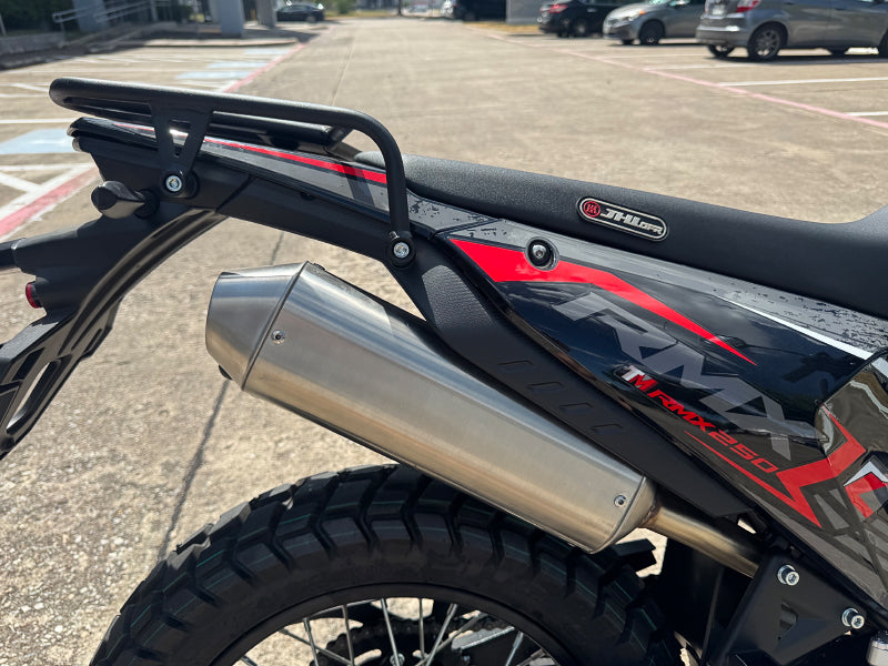 Close-up of TrailMaster RMX250 seat, exhaust pipe, and rear fender with RMX250 decal