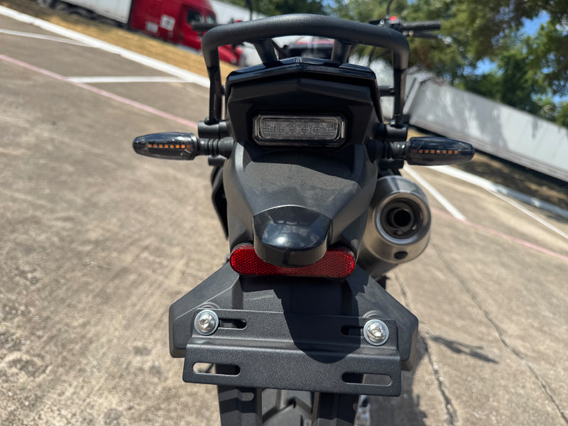 Rear view of TrailMaster RMX250 showing LED taillight and license plate bracket