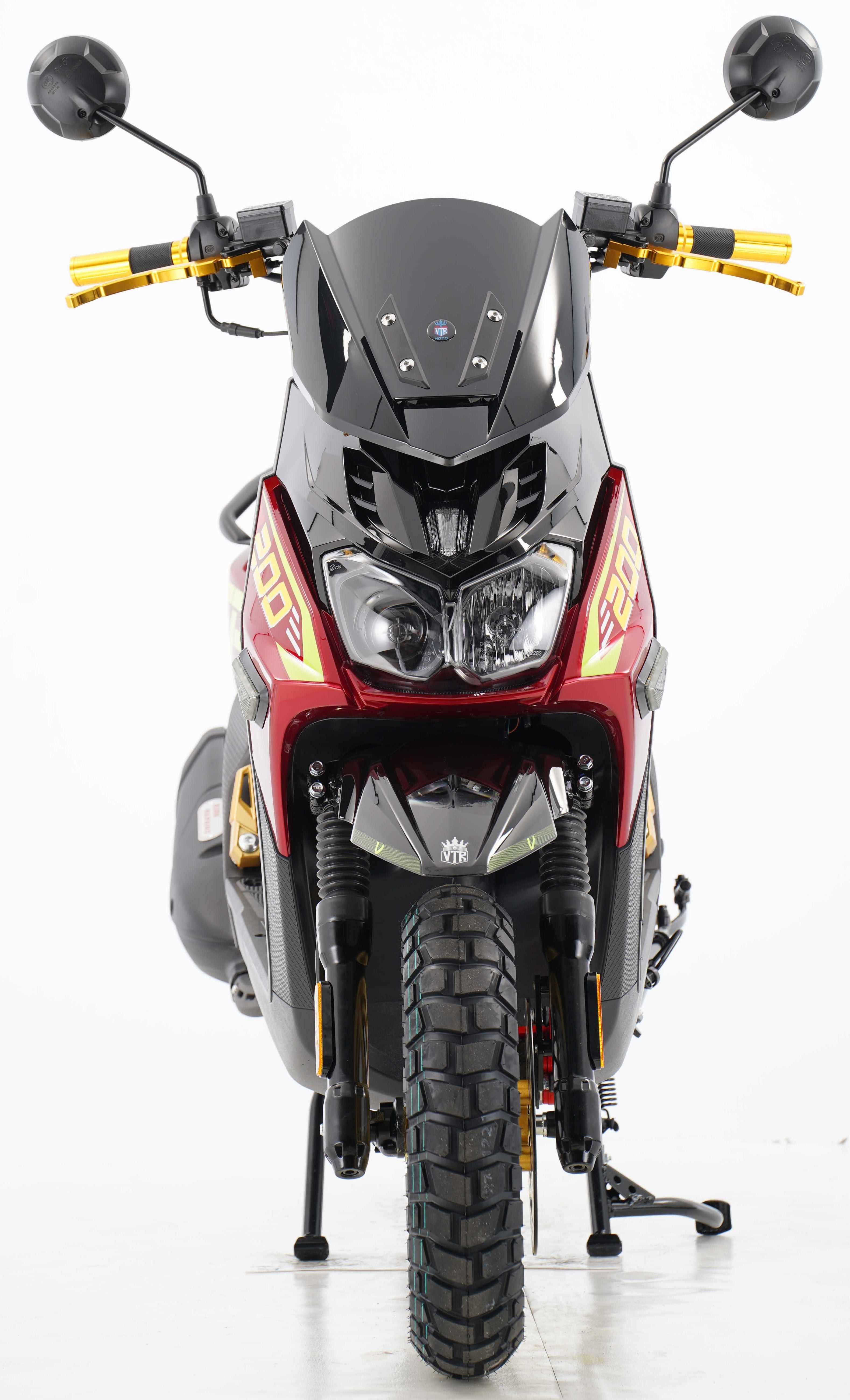 Red and black VTR 200 scooter front view with dual headlights and knobby tire
