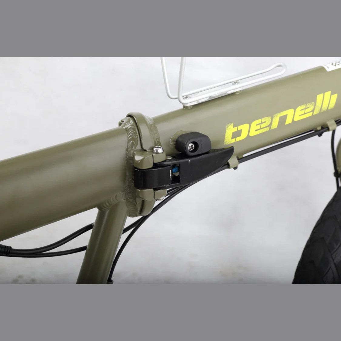 Close-up of olive green Benelli folding latch on E-Fold 500 electric bicycle frame