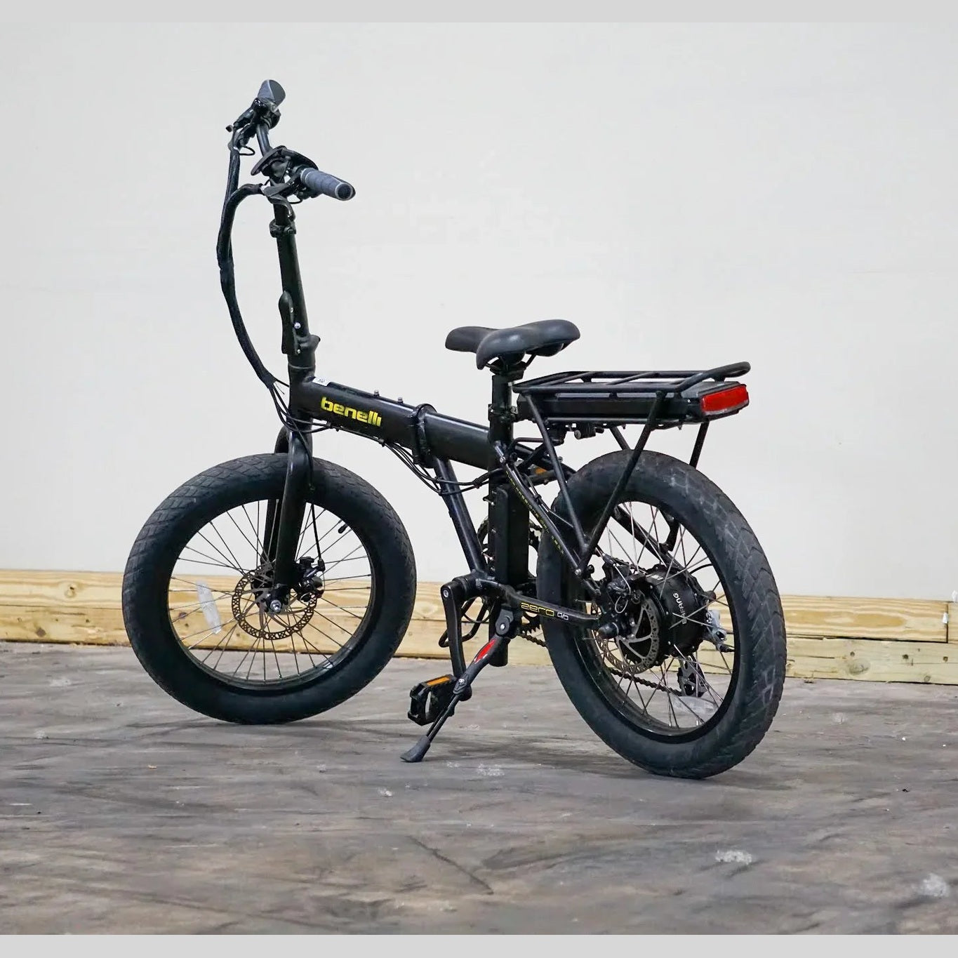 Rear three-quarter view of black Benelli E-Fold 500 e-bike with fat tires and battery pack