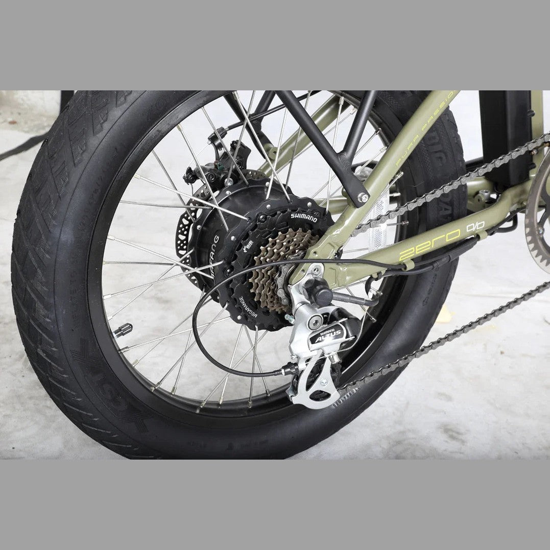 Olive green Benelli rear wheel assembly showing WEGANG hub motor and Shimano cassette