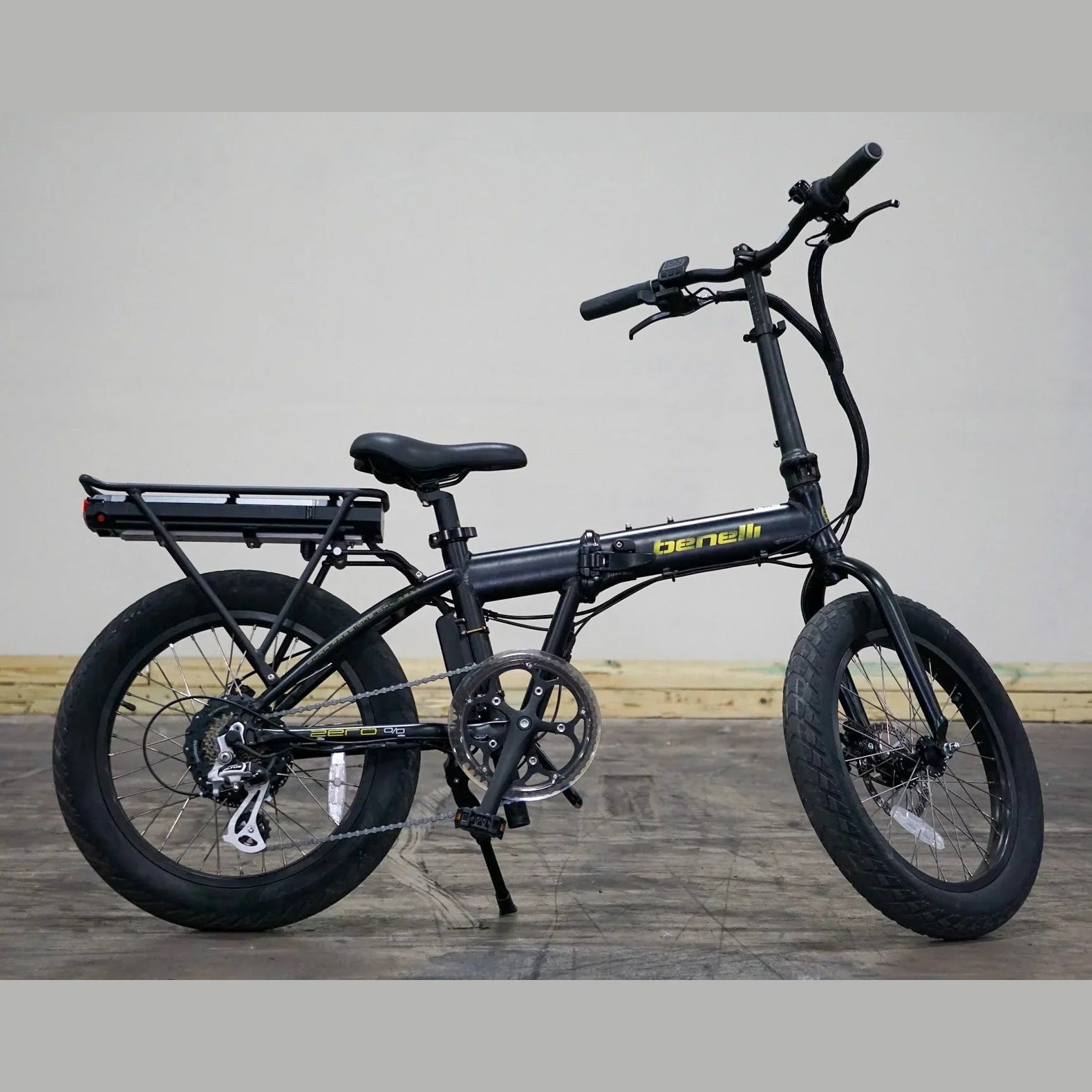Black Benelli E-Fold 500 folding electric bike side view with disc brakes and rear rack