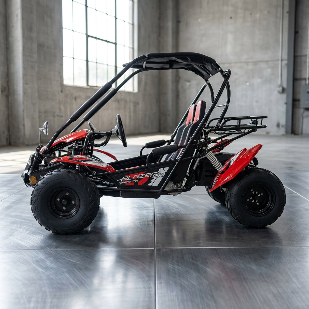 Red and black TrailMaster Blazer i2K go kart side profile with dual rear shocks outdoors