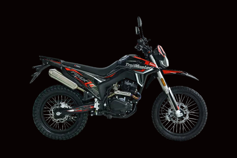Side view of black TrailMaster RMX250 with red graphics and chrome exhaust
