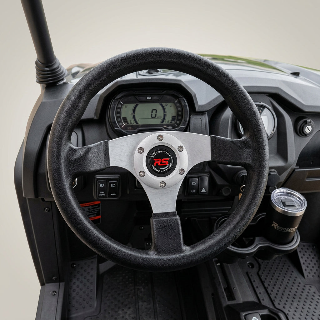 Close-up of black three-spoke steering wheel with red logo on Vitacci Rover dashboard