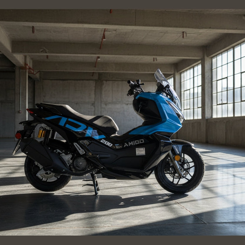 Side profile of blue Amigo 200 scooter with bold graphics and gold rear shock