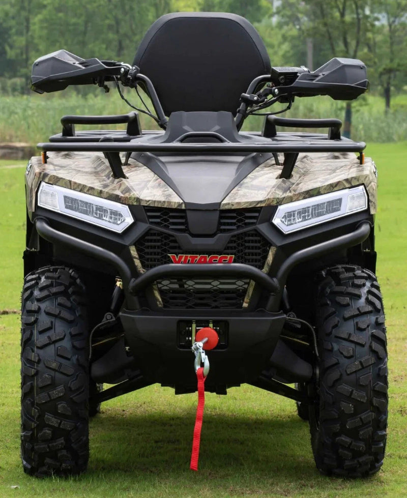 Camouflage Vitacci ATV with LED lights, front bumper, and winch on grassy field