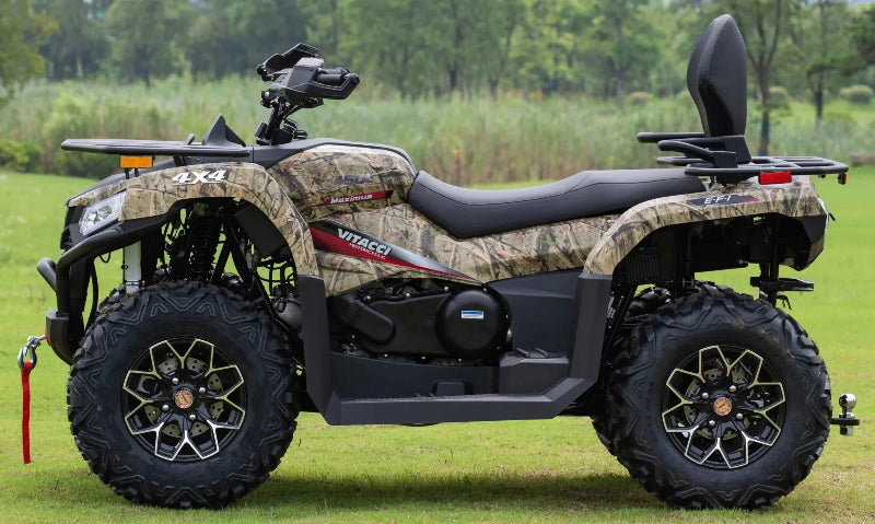 Camouflage vitacci Maximus 4x4 ATV with EFI engine, rugged tires, and rear cargo rack on grassy field