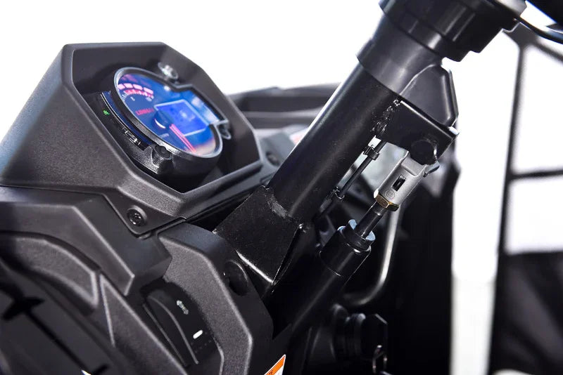 Close-up of UTV digital dashboard and steering column with illuminated display