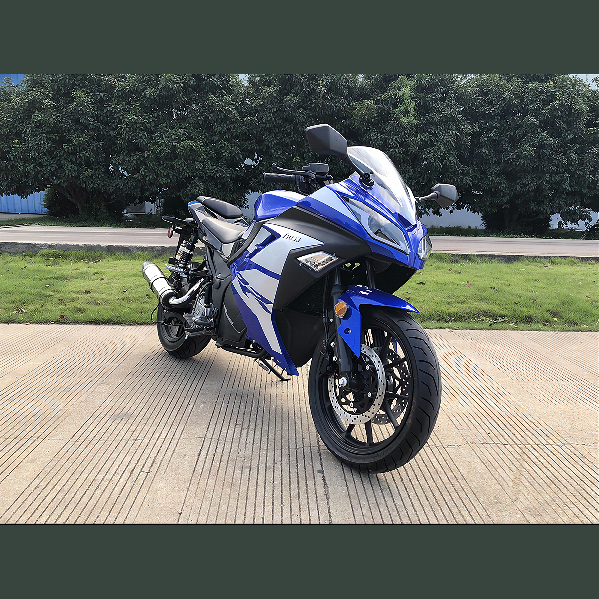 Blue and white Apollo Falcon 250cc automatic scooter front three-quarter view