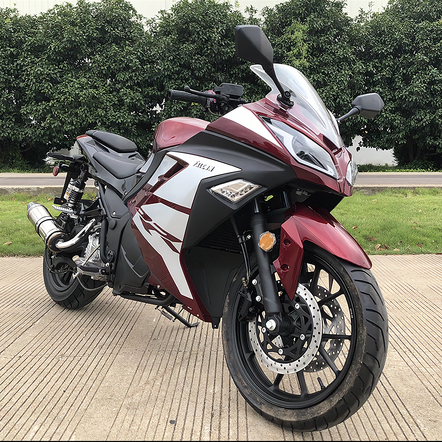 Maroon and white Apollo Falcon 250 EFI sport bike front three-quarter view