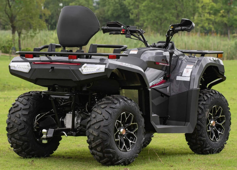 Gray Vitacci Maximus 4x4 ATV with rear rack, off-road tires, and EFI engine on grassy field