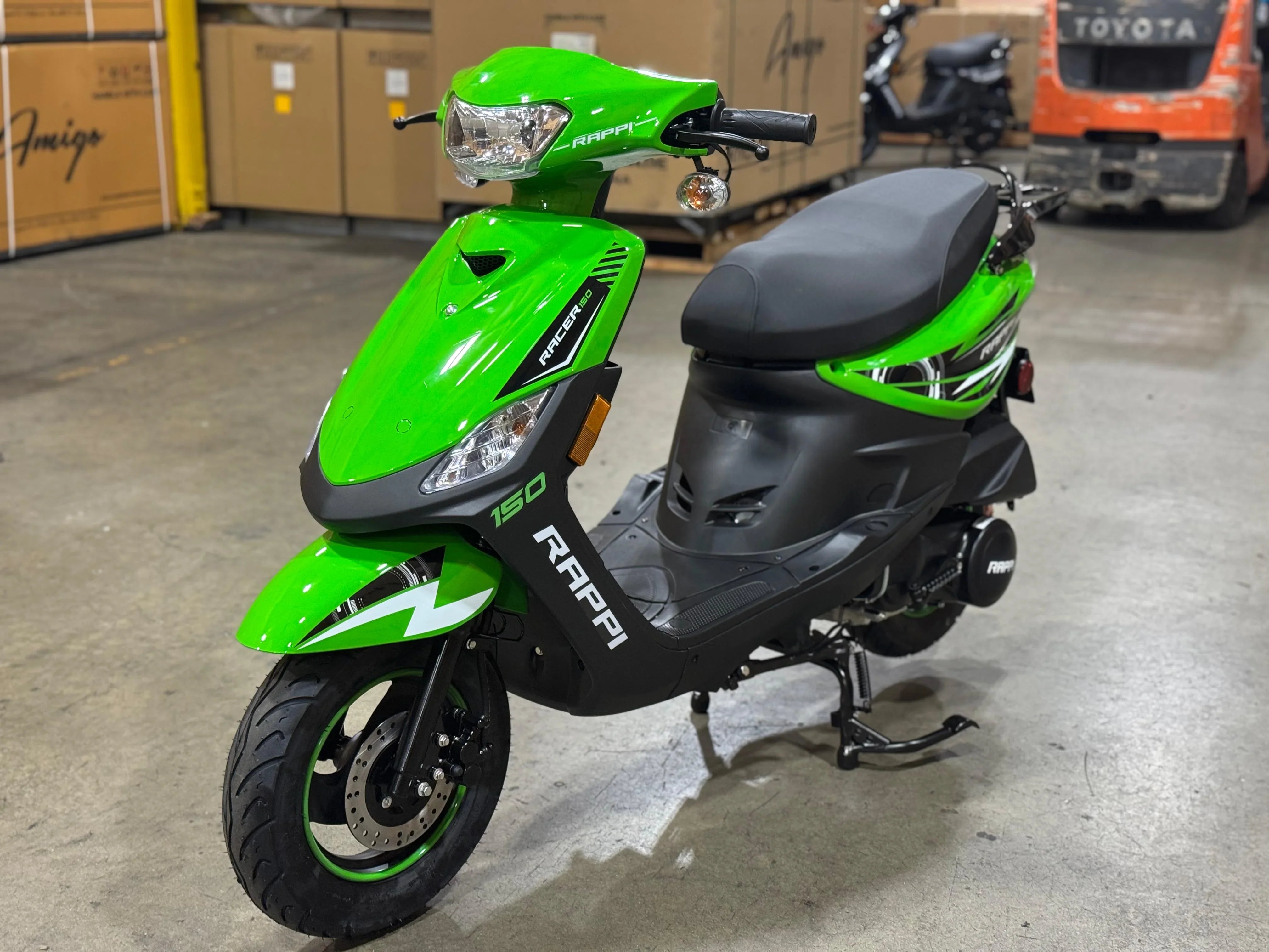 Bright green Rappi Racer 150 scooter in warehouse, ideal for urban commuting and powersports enthusiasts.