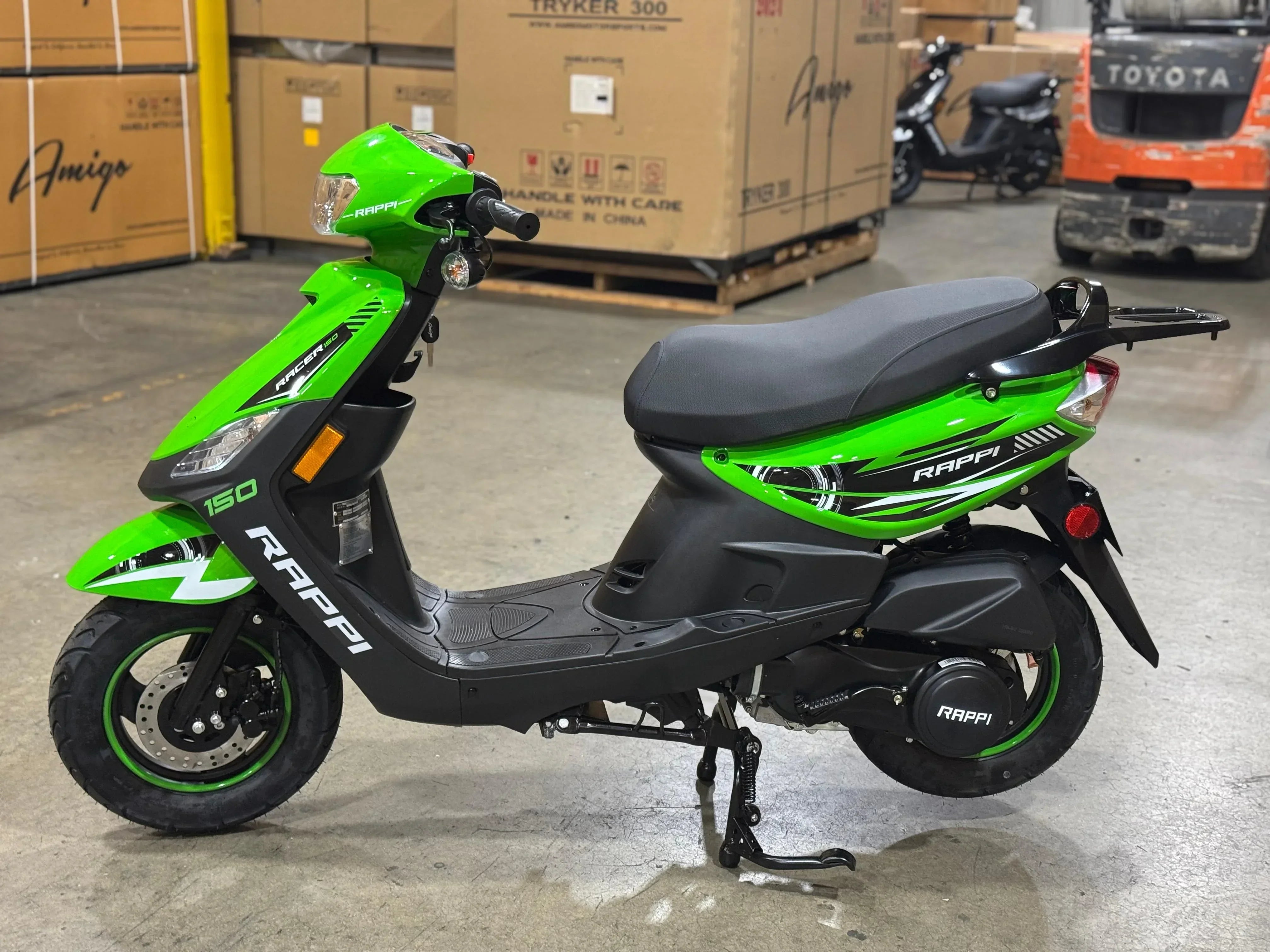 Bright green Rappi Racer 150 scooter in warehouse, ideal for urban commuting and powersports enthusiasts.
