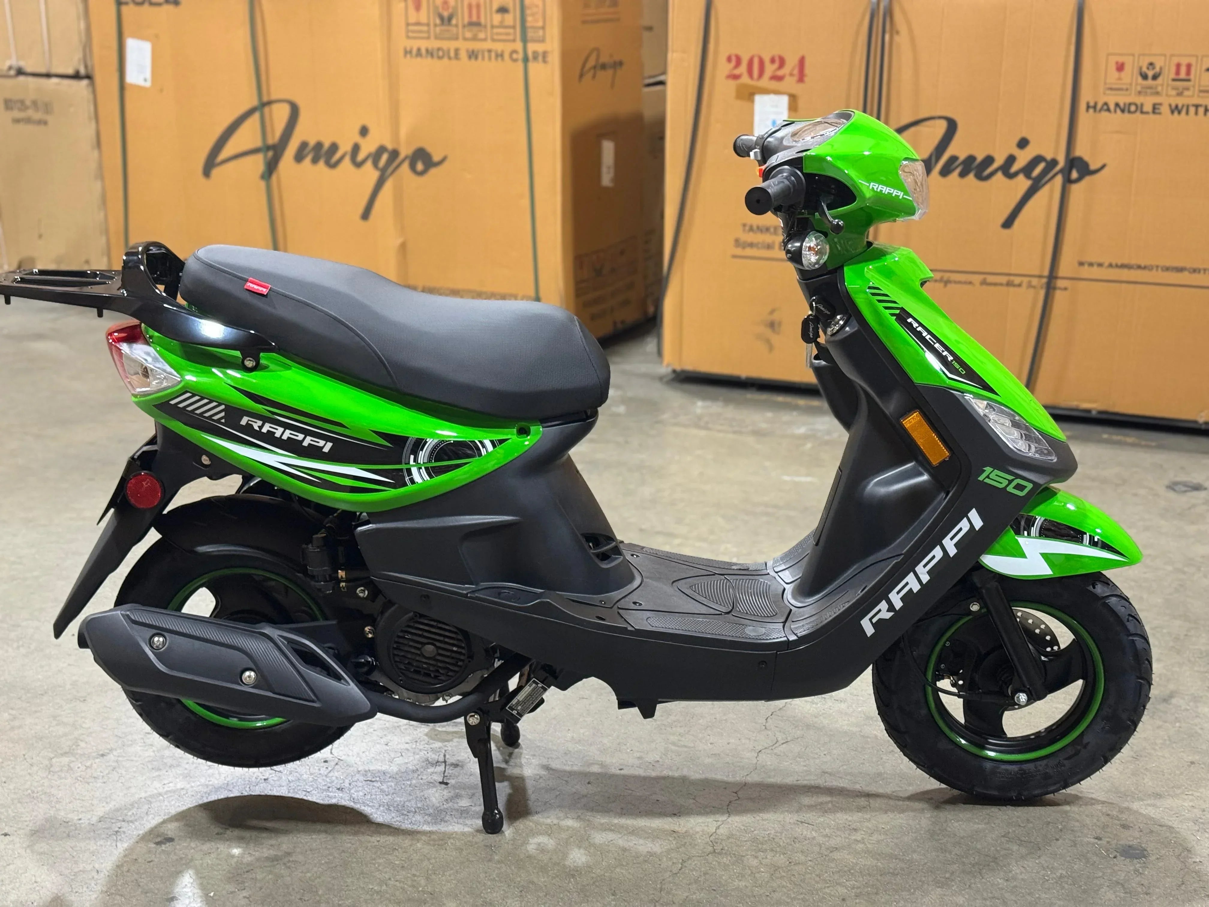 Green and black Rappi Racer 150 scooter in warehouse, ideal for urban commuting and powersports enthusiasts.