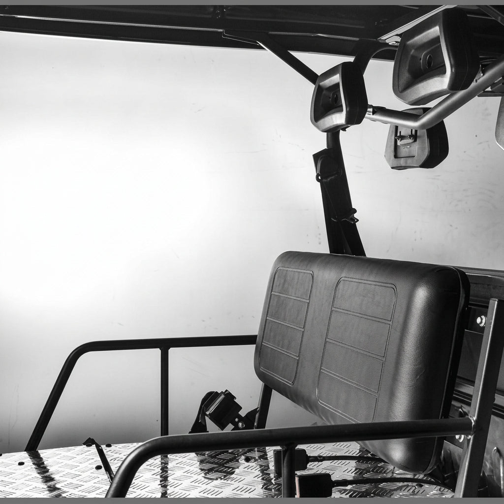 Black-and-white interior shot of Vitacci Rover rear seat with textured upholstery