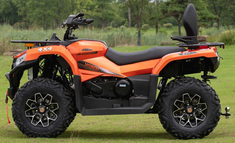 Orange Vitacci  MAXIMUS 4x4 ATV 450L, rugged tires, and rear cargo rack on grassy field