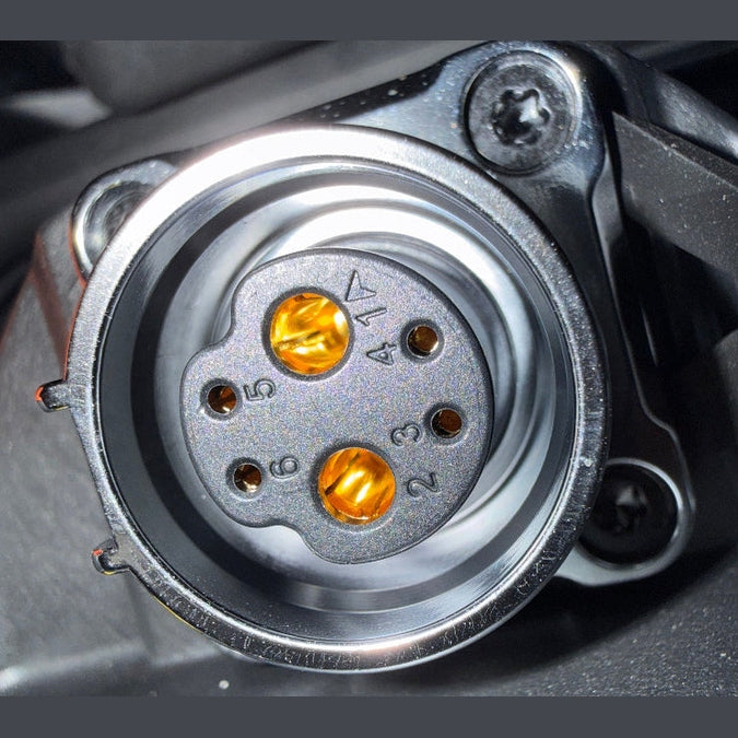 Surron Ultra Bee electrical connector with six numbered ports and amber LED indicators