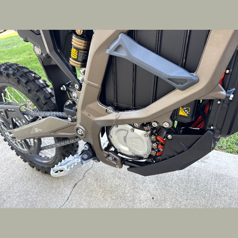 Surron Ultra Bee electric dirt bike matte taupe frame with silver motor cover and knobby tires