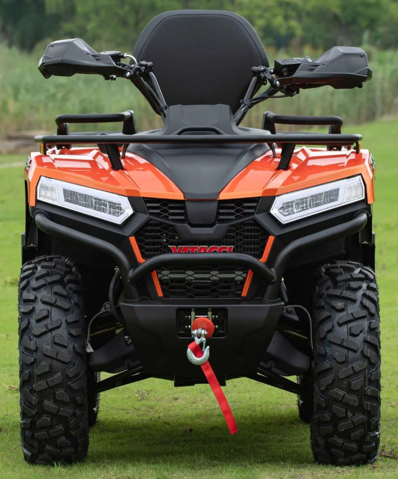 Orange Vitacci MAXIMUS 450L EFI ATV with black accents, front grille, and tow hook on grassy field