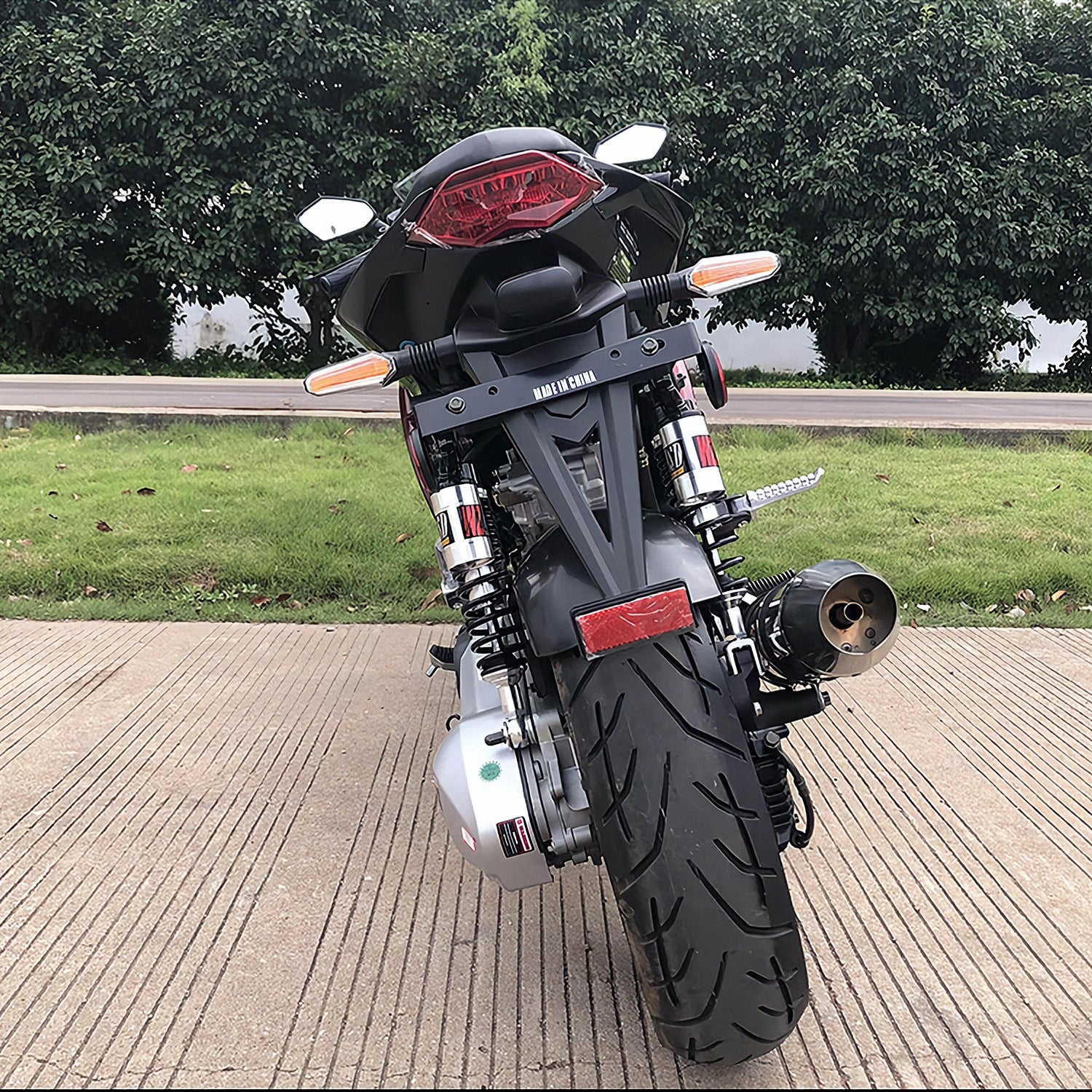 Rear view of black Apollo Falcon XR 250 scooter showing LED taillight and wide tire