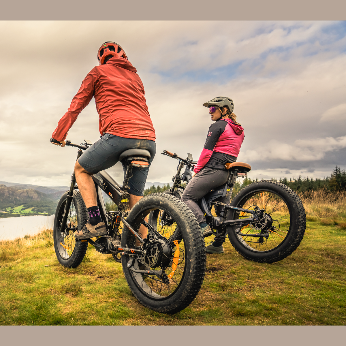 Two riders on Freesky fat tire e-bikes overlooking lake