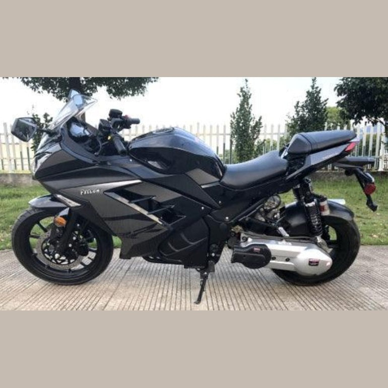 Black automatic 200cc motorcycle parked outdoors with angular silver accents