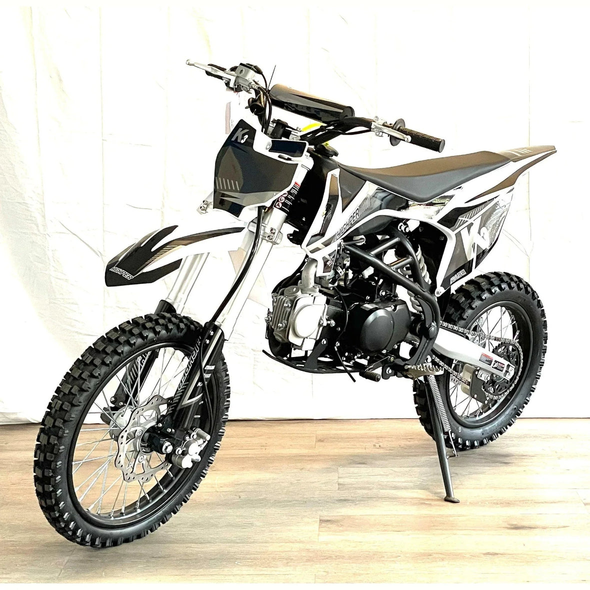 Black XTR K3 PRO 125cc manual dirt bike side view showing heavy-duty twin spar frame