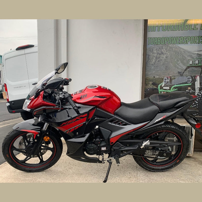 Red Lifan KPR 200 motorcycle parked outdoors near storefront