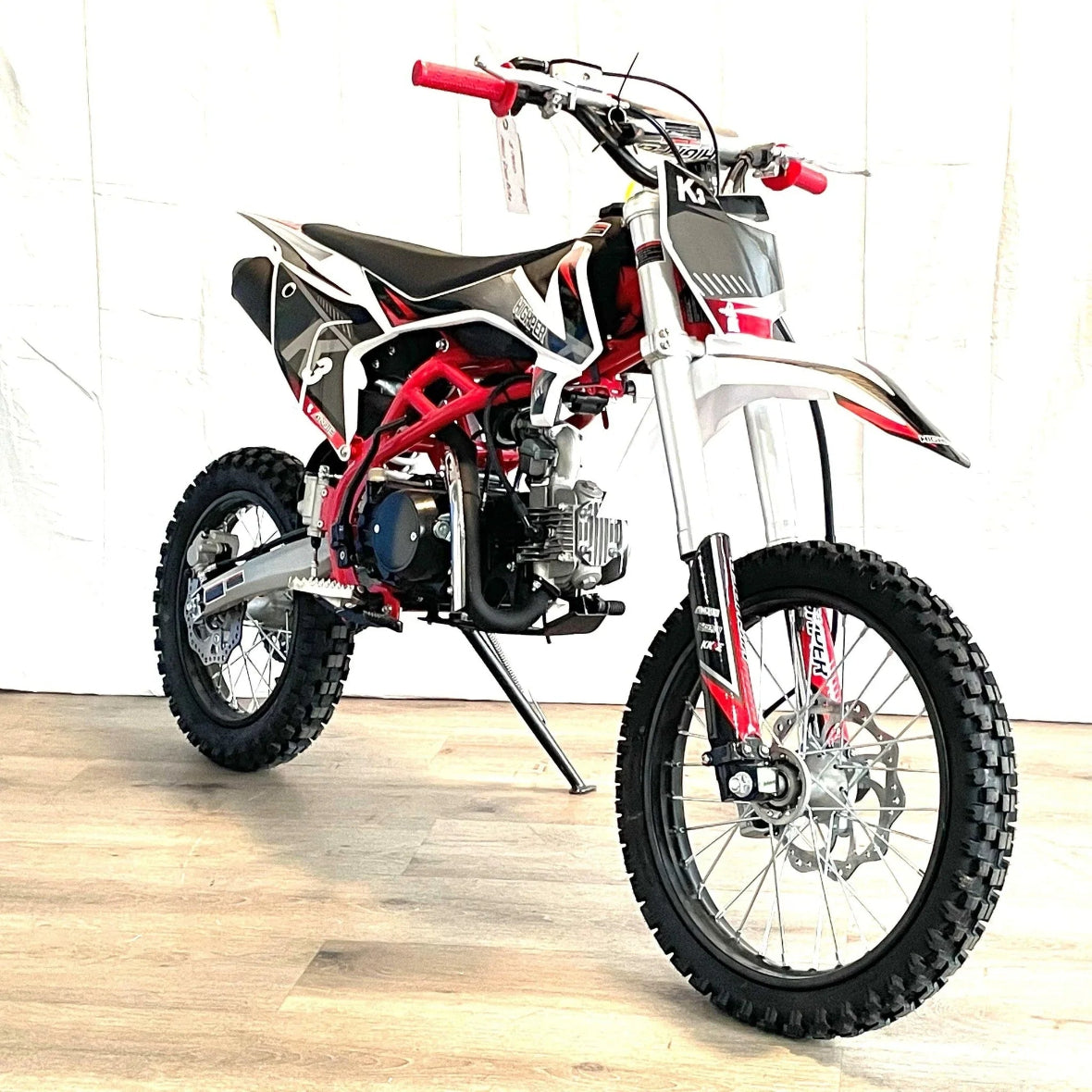 Red XTR K3 PRO 125cc manual kick start dirt bike with white and black bodywork
